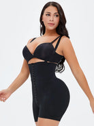 NEWYORKLISTED Intimate Apparel: Woman wearing a black shapewear bodysuit on a white background