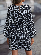 NEWYORKLISTED STYLE COLLECTION: Black dress with white geometric pattern worn by a person on a blurred street background