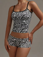 NEWYORKLISTED INTIMATE APPAREL COLLECTION: Person wearing a zebra print tank top and shorts set against a neutral background
