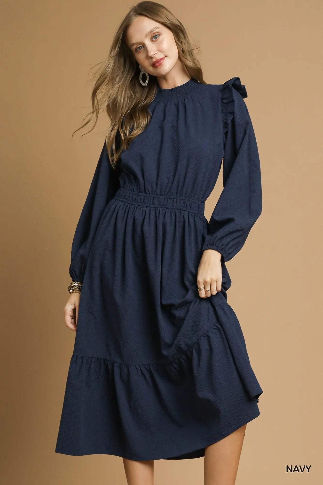 Textured midi dress with ruffle shoulder detail from NEWYORKLISTED STYLE COLLECTION – chic and versatile women’s fashion.