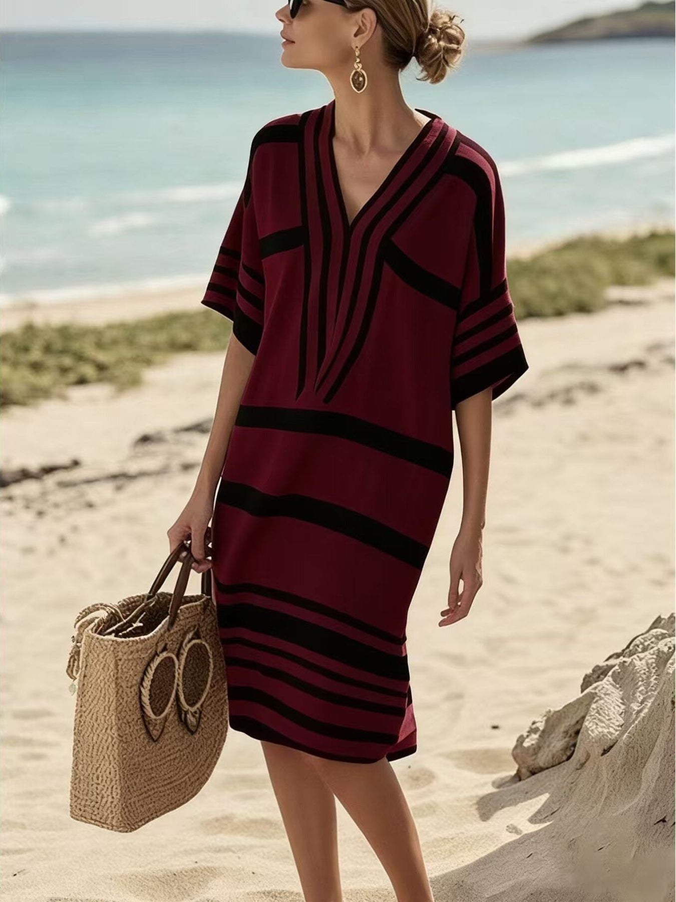NEWYORKLISTED STYLE COLLECTION: Woman in a red and black striped dress on a beach