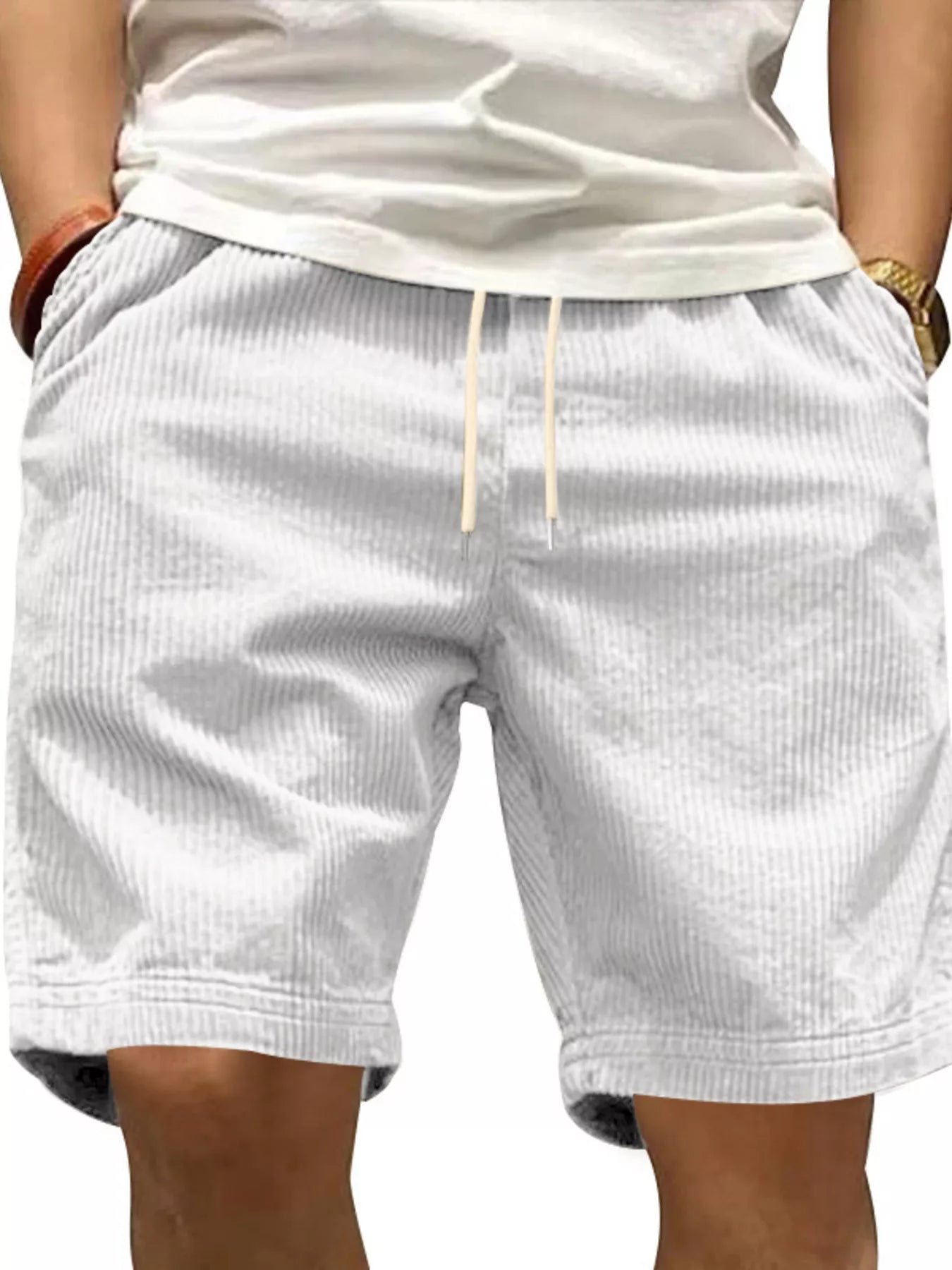 NEWYORKLISTED ATLAS MEN'S COLLECTION: White shorts worn by a person with a neutral background