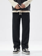 NEWYORKLISTED ATLAS MEN's COLLECTION: Person wearing black pants with a white background