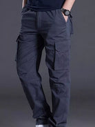 NEWYORKLISTED ATLAS MEN's COLLECTION: Person wearing dark blue cargo pants on a gray background