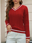 NEWYORKLISTED STYLE COLLECTION: Red cable knit sweater with white trim worn by a person against a neutral background