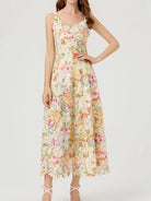 NEWYORKLISTED STYLE COLLECTION: Woman wearing a floral dress on a white background