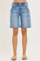 NEWYORKLISTED STYLE COLLECTION: Denim shorts worn by a person on a white background