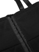 NEWYORKLISTED Intimate Apparel: Close-up of a black bag with straps on a white background