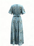 NEWYORKLISTED STYLE COLLECTION: Light blue floral dress with a belt on a white background