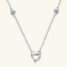 NEWYORKLISTED Valentine’s Day Specials: Silver necklace with a heart-shaped pendant on a white background