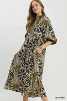 NEWYORKLISTED STYLE COLLECTION: Woman wearing a patterned dress with a white background