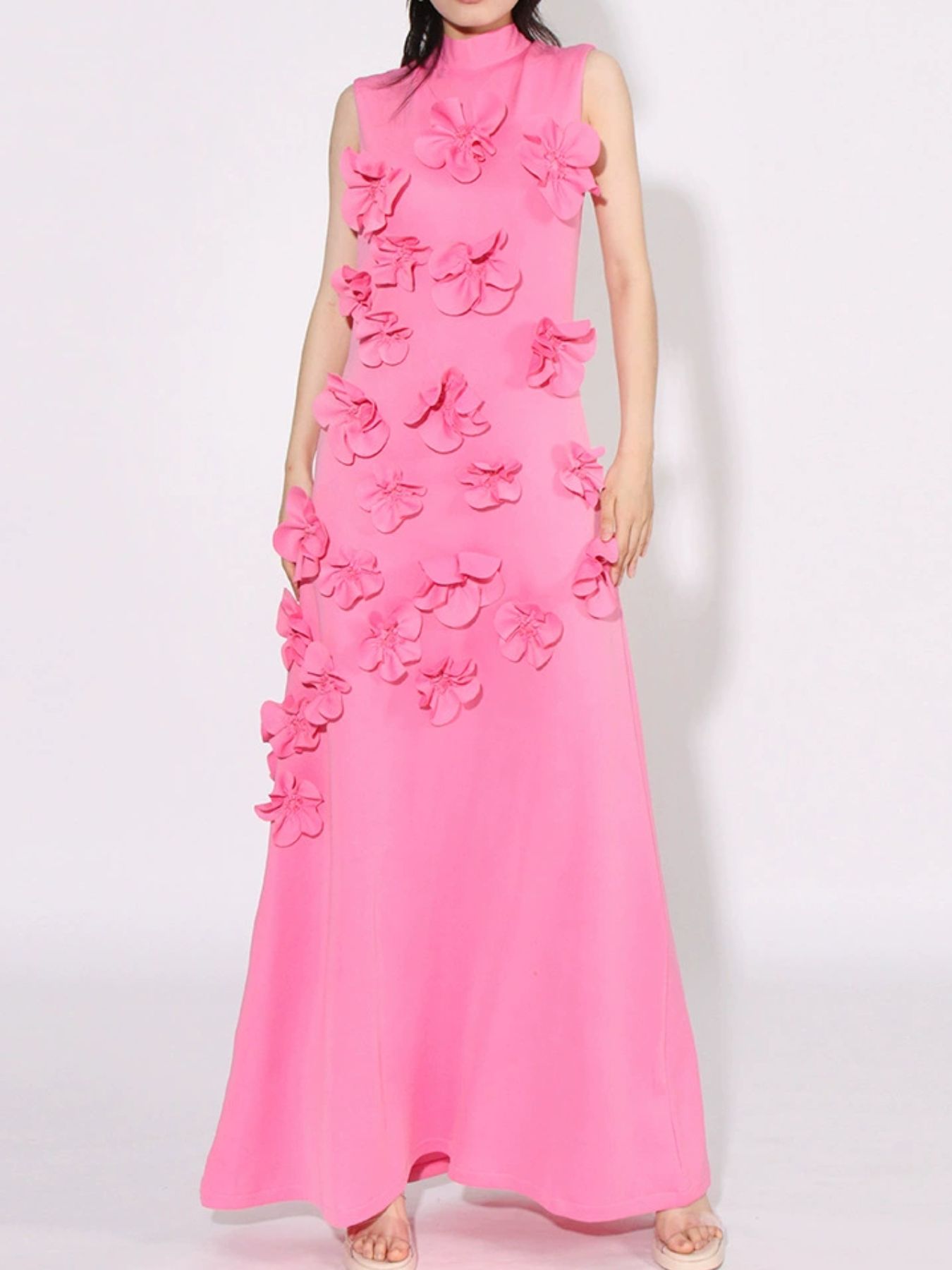 NEWYORKLISTED STYLE COLLECTION: Pink evening gown with floral embellishments on a white background