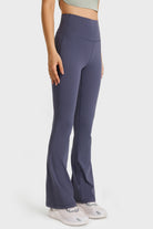 NEWYORKLISTED ACTIVEWEAR COLLECTION: Person wearing high-waisted flared pants on a white background