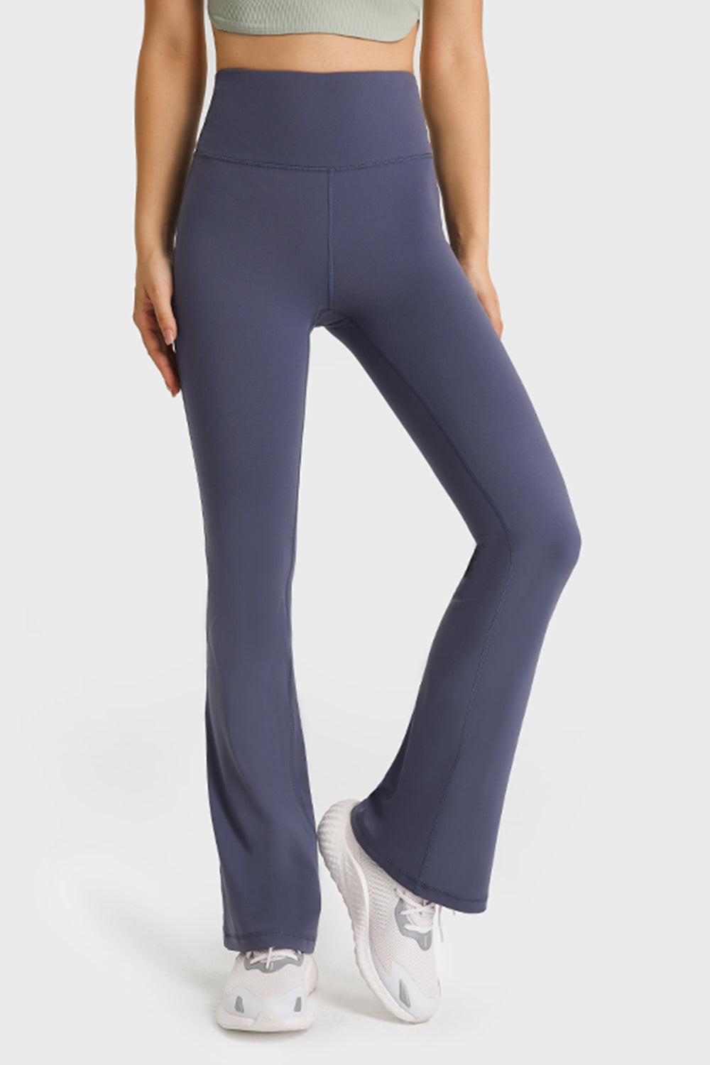 NEWYORKLISTED ACTIVEWEAR COLLECTION: Person wearing purple leggings on a white background