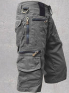 NEWYORKLISTED ATLAS MEN'S COLLECTION: Gray cargo shorts with multiple pockets and zippers on a gray background