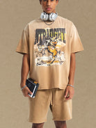 NEWYORKLISTED ATLAS MEN'S COLLECTION: Person wearing a beige t-shirt with a graphic design on a plain background
