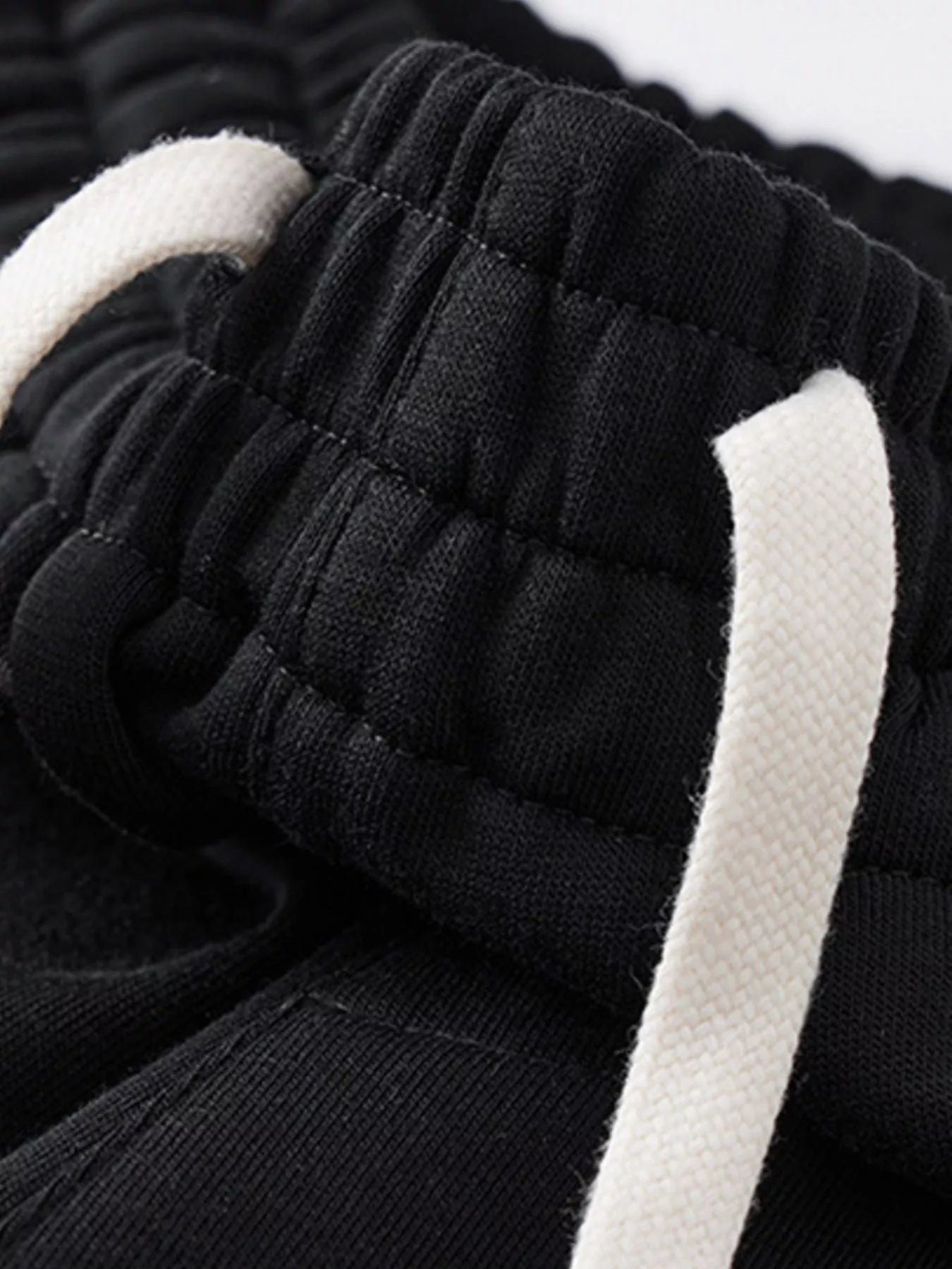 NEWYORKLISTED ATLAS MEN's COLLECTION: Close-up of black and white fabric with textured pattern