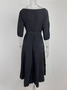 NEWYORKLISTED STYLE COLLECTION: Black dress on a mannequin against a white background