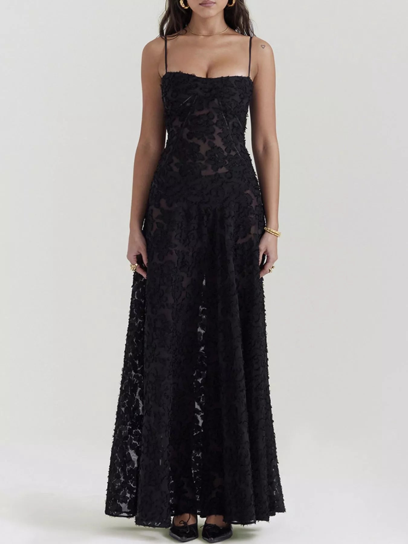 NEWYORKLISTED STYLE COLLECTION: Black lace dress worn by a model on a white background