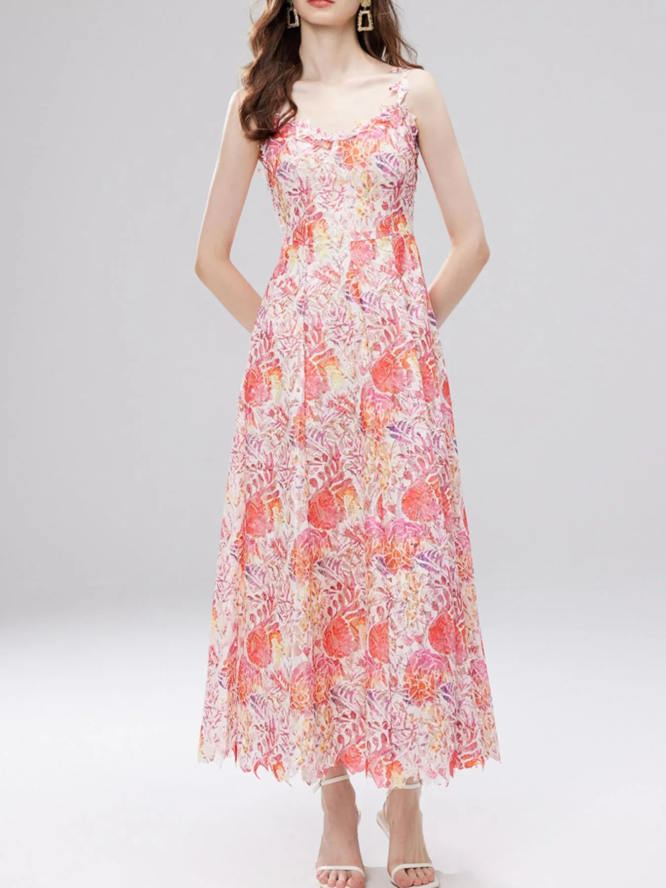 NEWYORKLISTED STYLE COLLECTION: Woman wearing a floral dress on a white background