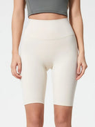 NEWYORKLISTED ACTIVEWEAR COLLECTION: Person wearing white athletic shorts on a plain background