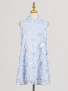 NEWYORKLISTED STYLE COLLECTION: Light blue floral dress on a mannequin against a plain background