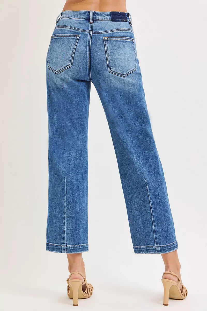 NEWYORKLISTED DENIM COLLECTION: Blue jeans worn by a person on a white background