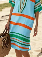 NEWYORKLISTED STYLE COLLECTION: Person wearing a colorful striped dress on a beach