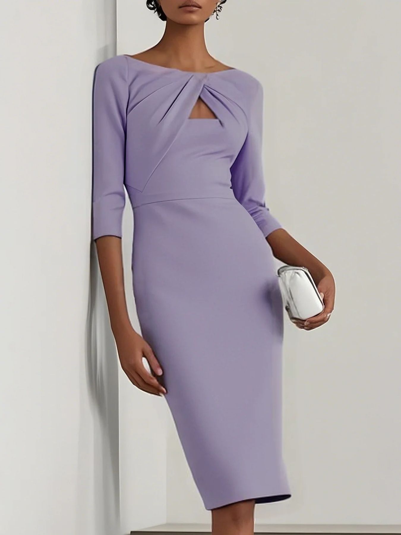 NEWYORKLISTED STYLE COLLECTION: Woman wearing a purple dress holding a clutch against a plain background