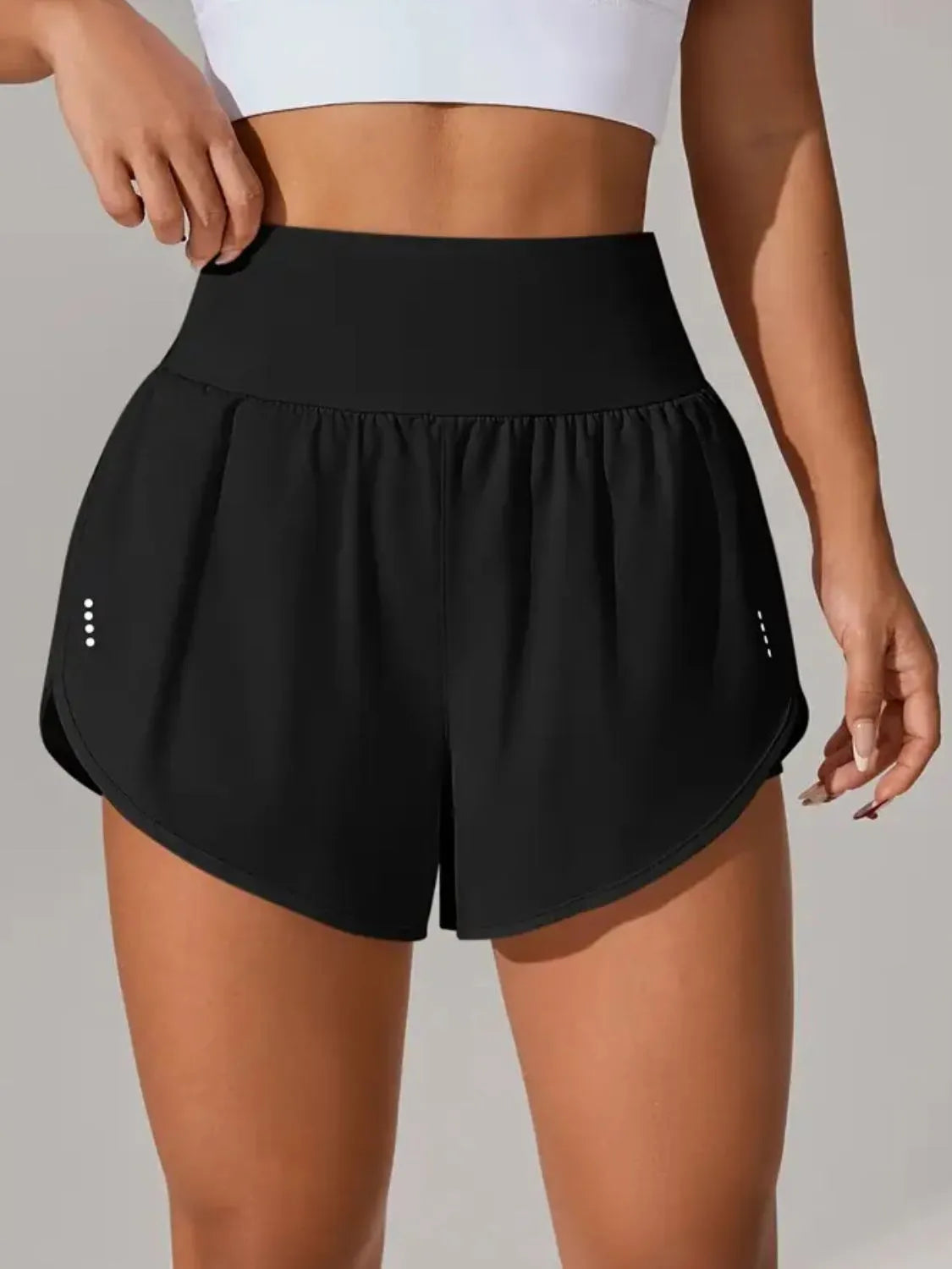 NEWYORKLISTED Activewear: Black athletic shorts worn by a person on a neutral background