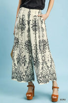 NEWYORKLISTED STYLE COLLECTION: Person wearing a patterned skirt on a light blue background
