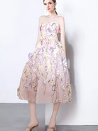 NEWYORKLISTED STYLE COLLECTION: Woman wearing a floral strapless dress on a white background