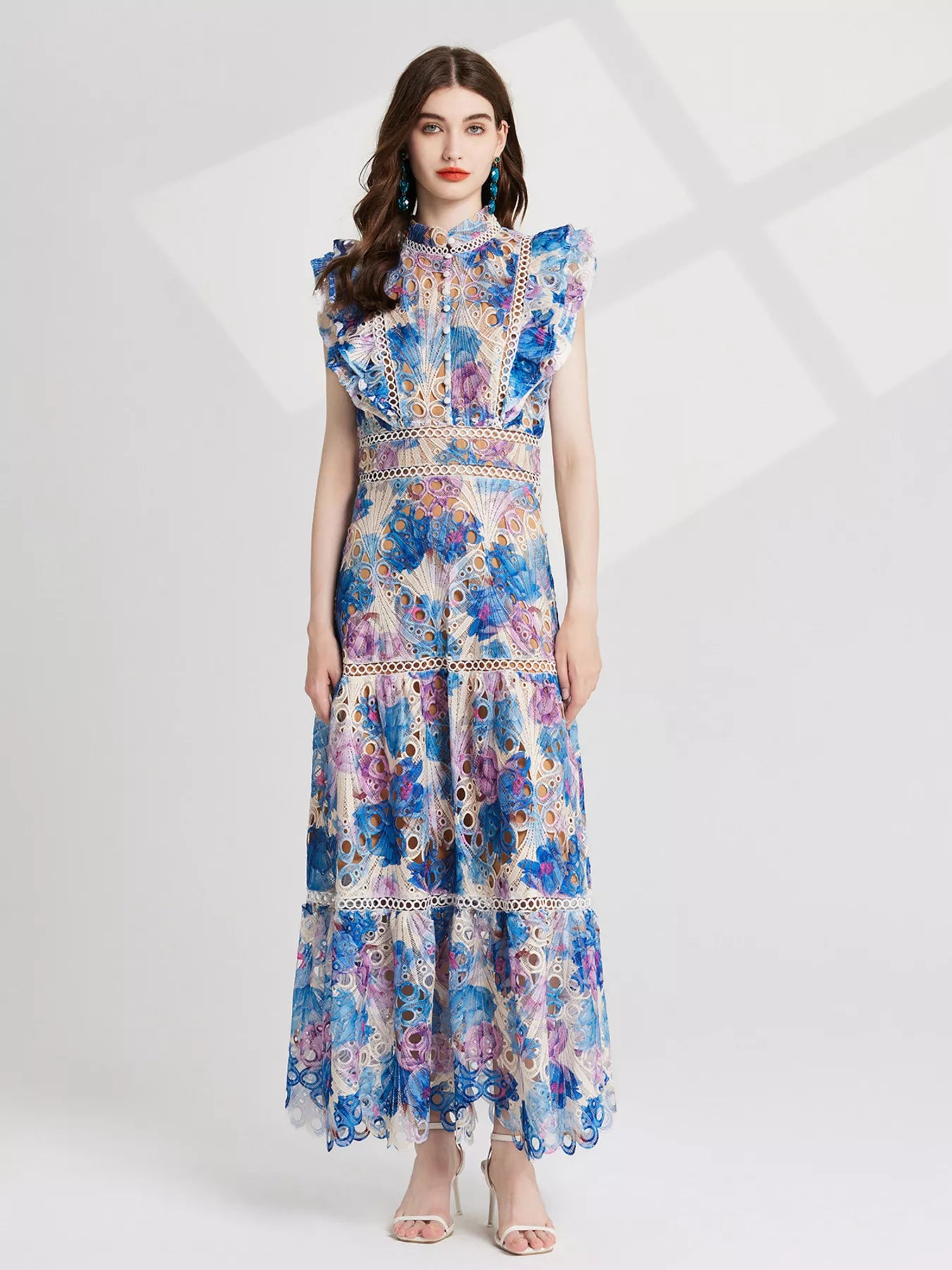NEWYORKLISTED STYLE COLLECTION: Woman wearing a floral dress on a white background