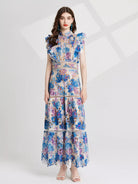 NEWYORKLISTED STYLE COLLECTION: Woman wearing a floral dress on a white background
