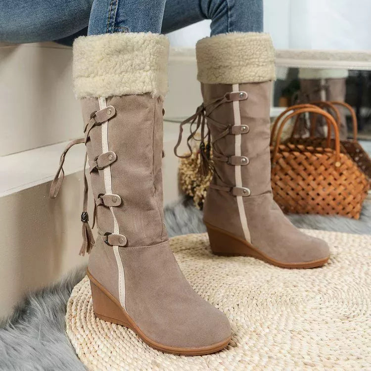 NEWYORKLISTED SHOE COLLECTION: Brown suede boots with fur trim worn by a person sitting on a bench.
