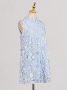 NEWYORKLISTED STYLE COLLECTION: Light blue floral dress on a mannequin against a plain background