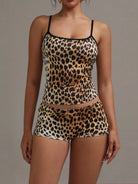 NEWYORKLISTED INTIMATE APPAREL COLLECTION: Leopard print lingerie set on a plain background