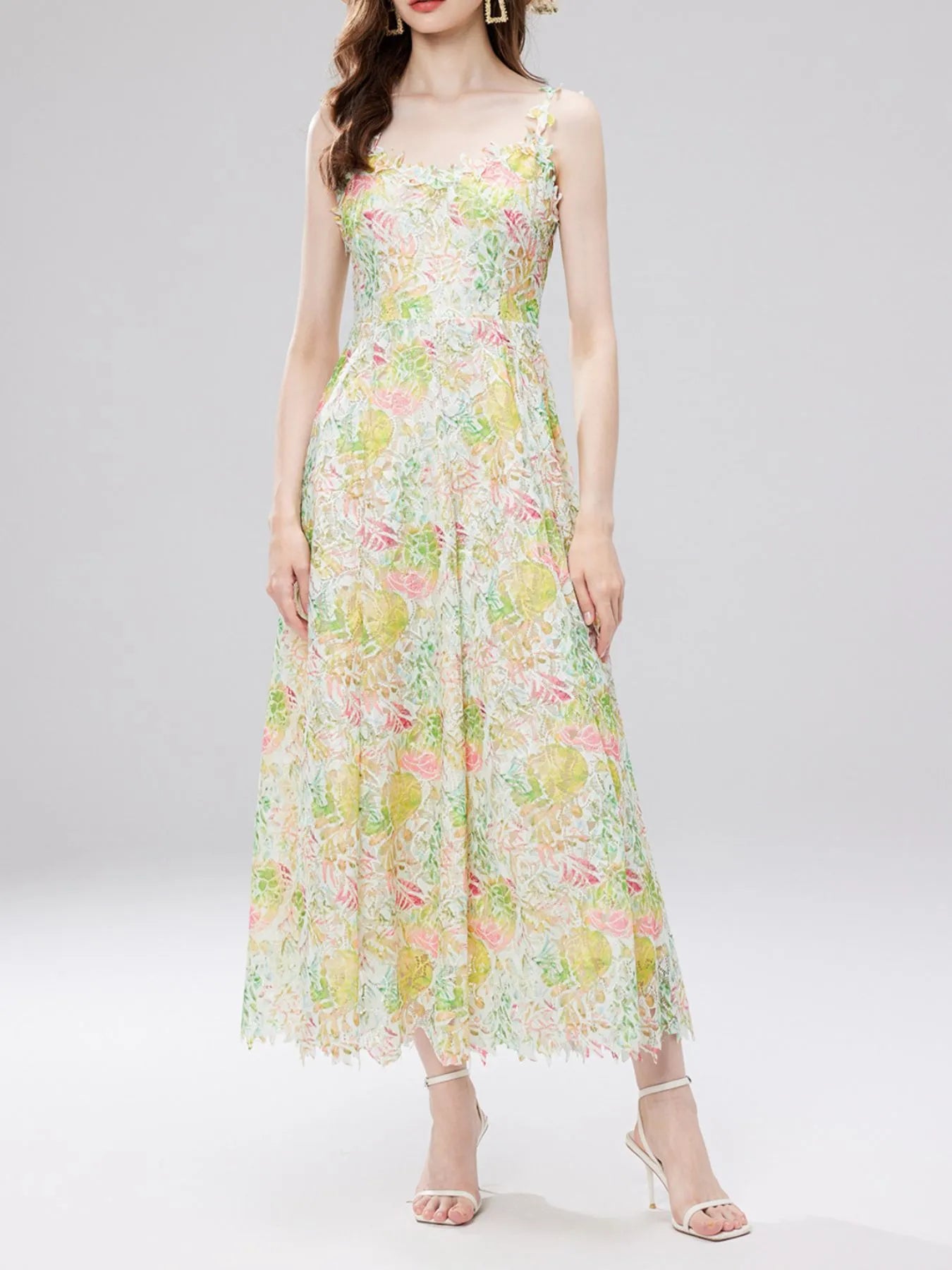 NEWYORKLISTED STYLE COLLECTION: Woman wearing a floral dress on a white background