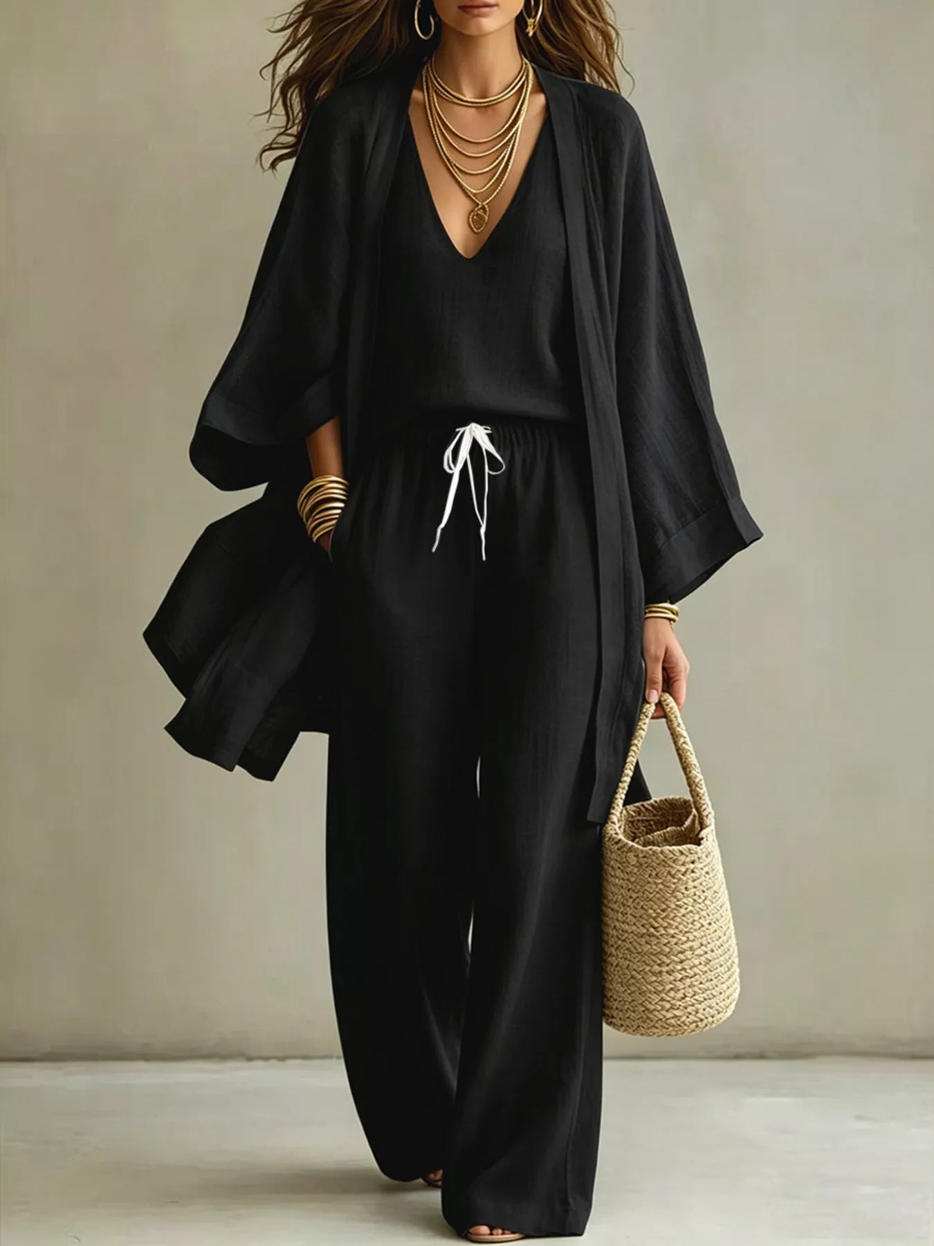 NEWYORKLISTED STYLE COLLECTION: Woman wearing a black outfit with a beige background
