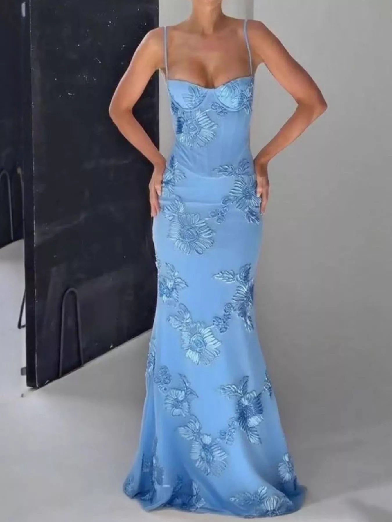 NEWYORKLISTED STYLE COLLECTION: Blue evening gown with floral embroidery on a gray background