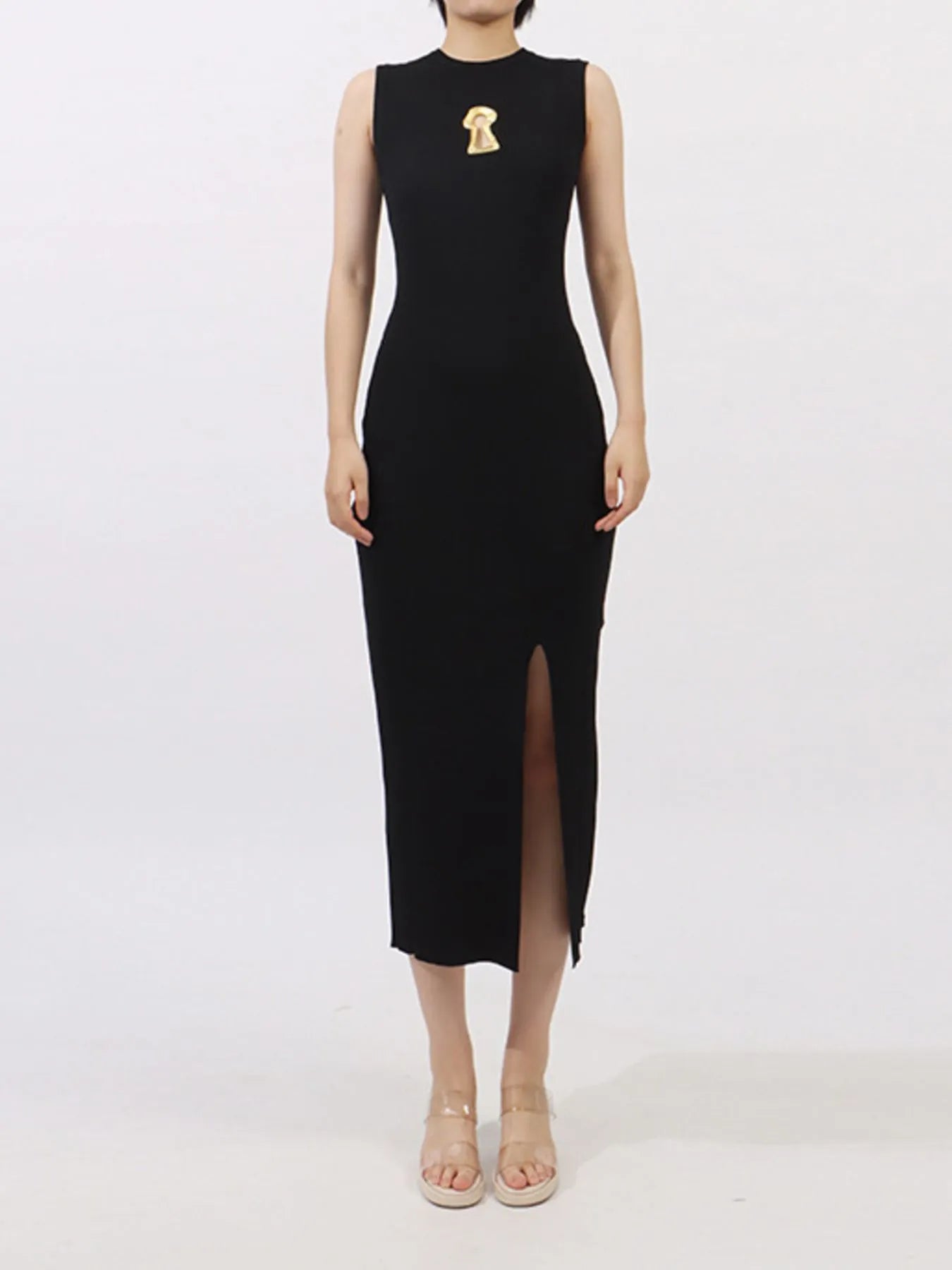 NEWYORKLISTED RUNWAY STYLE: Black sleeveless dress with a slit on a white background