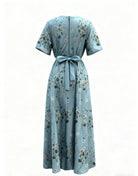 NEWYORKLISTED STYLE COLLECTION: Light blue dress with floral pattern on a white background