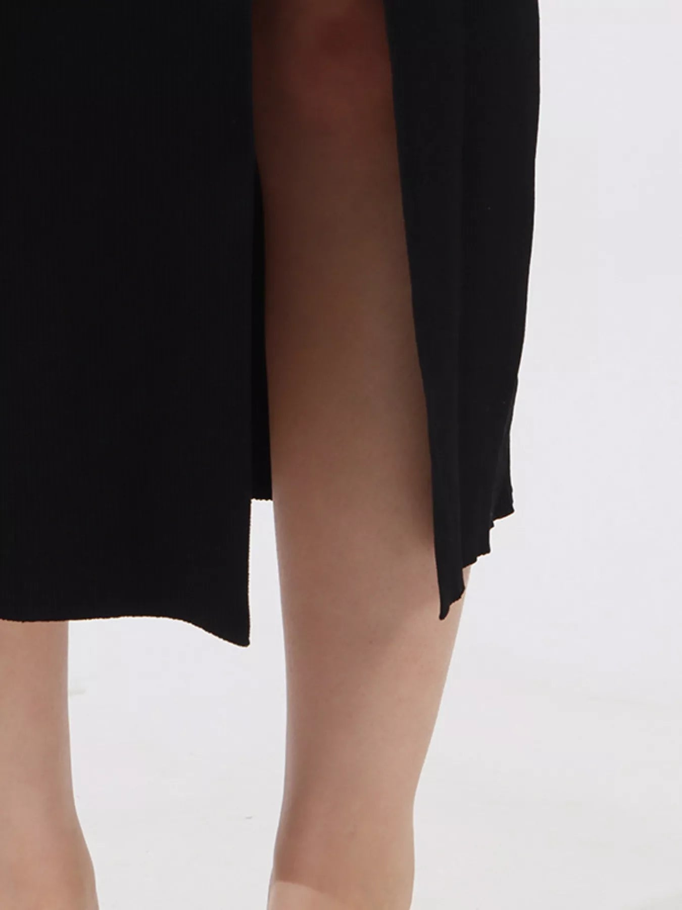 NEWYORKLISTED RUNWAY STYLE: Black sheer skirt being worn on a white background