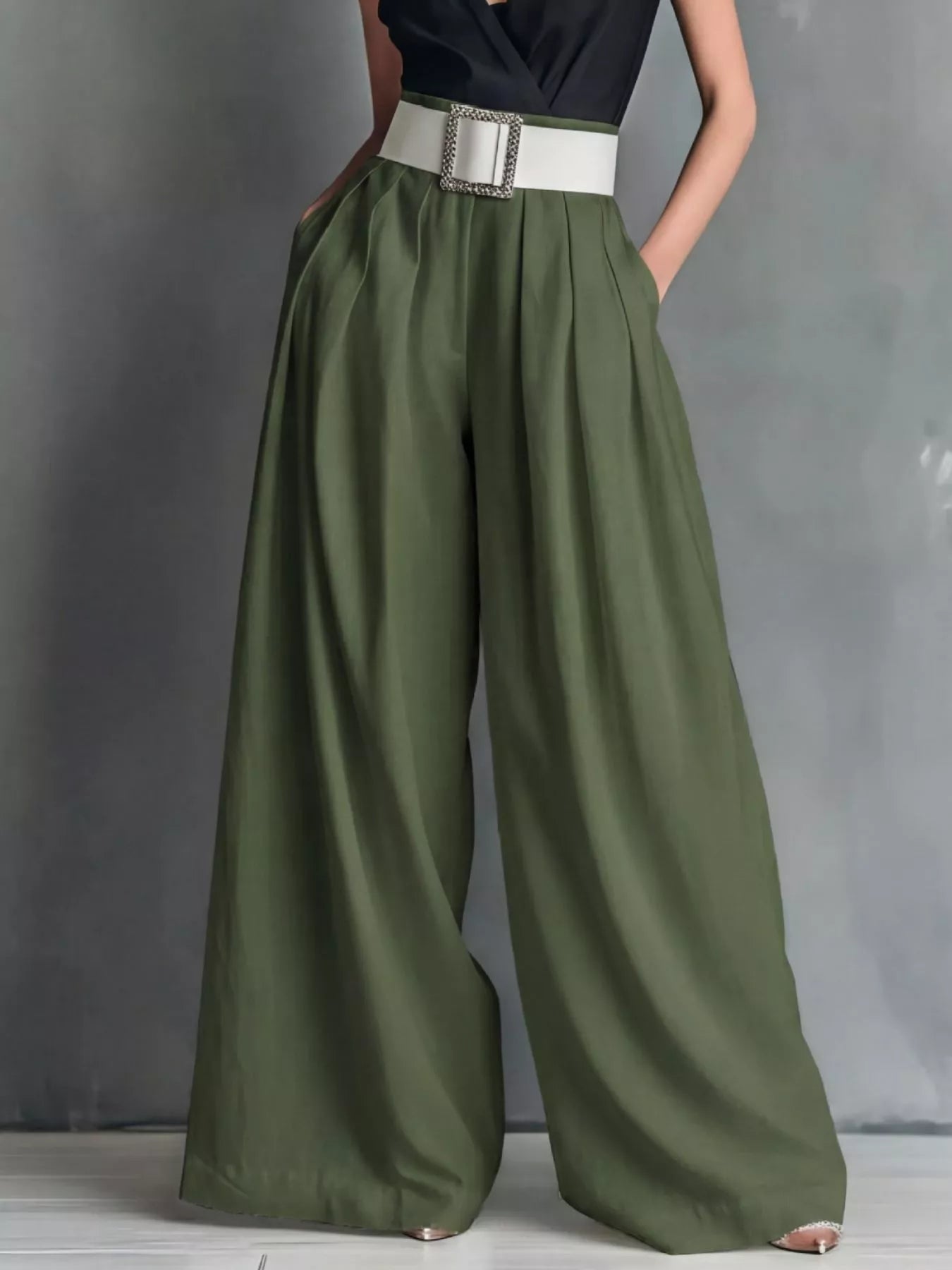 NEWYORKLISTED STYLE COLLECTION: Green wide-leg pants with a white belt on a gray background