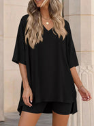NEWYORKLISTED COMFORT COLLECTION: Woman wearing a black outfit with a neutral background