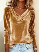 NEWYORKLISTED STYLE COLLECTION: Brown velvet long-sleeve top worn by a person with light blue jeans.