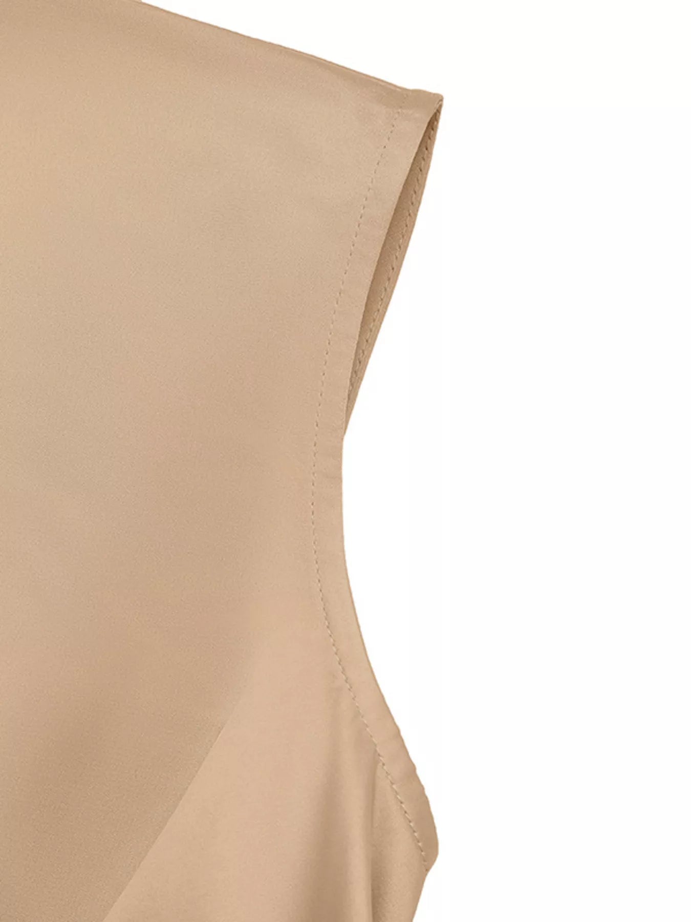 Close-up of a beige sleeveless top on a white background