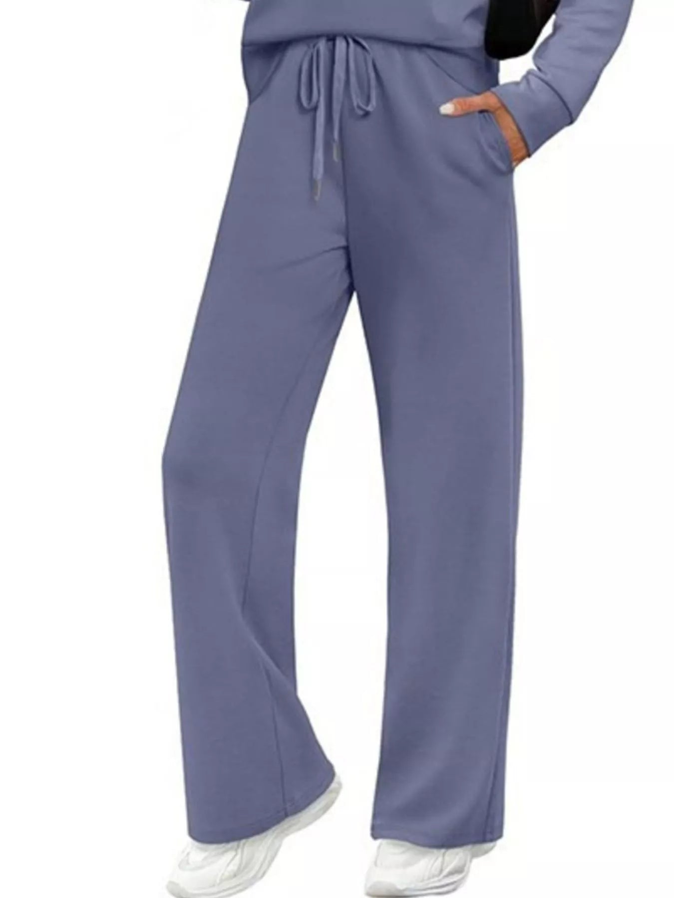 NEWYORKLISTED COMFORT COLLECTION: Purple scrubs with drawstring top and wide-leg pants on a white background