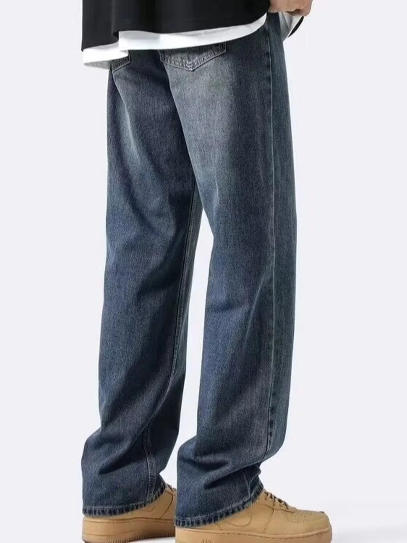 NEWYORKLISTED ATLAS MEN's COLLECTION: Person wearing blue jeans and tan shoes on a white background