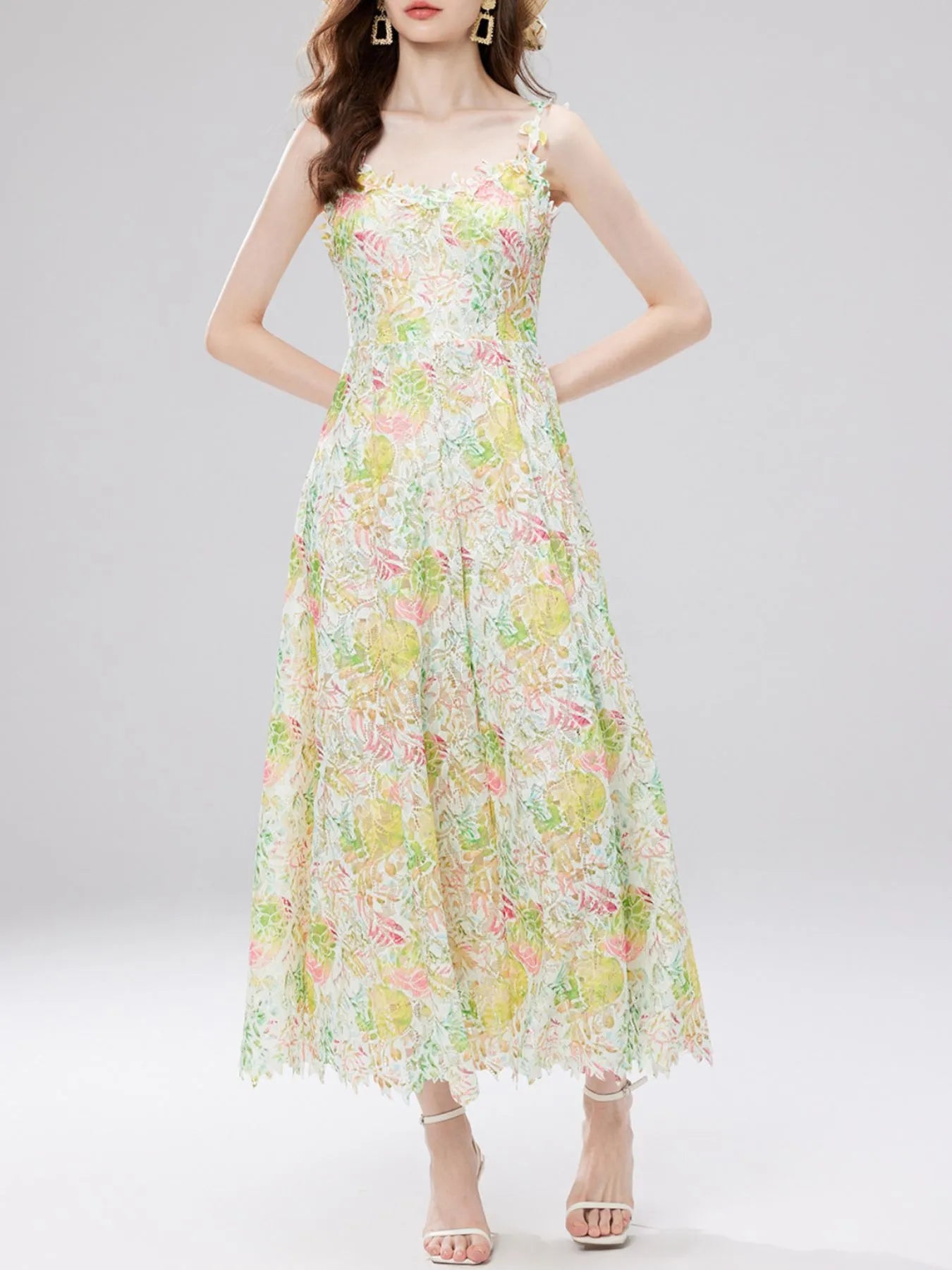 NEWYORKLISTED STYLE COLLECTION: Woman wearing a floral dress on a light gray background